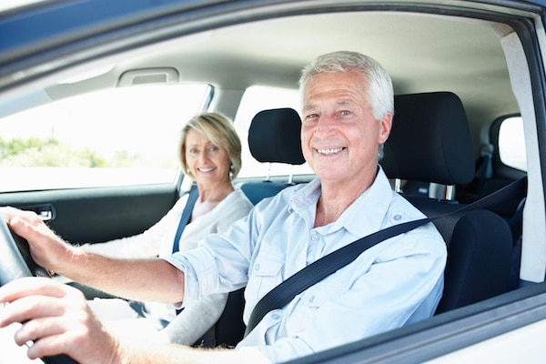 happy couple driving