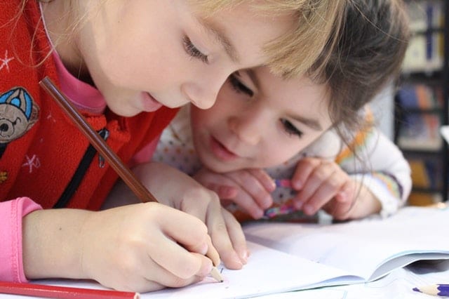 children working together on a school assignment