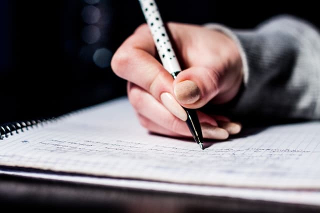 woman taking a written test