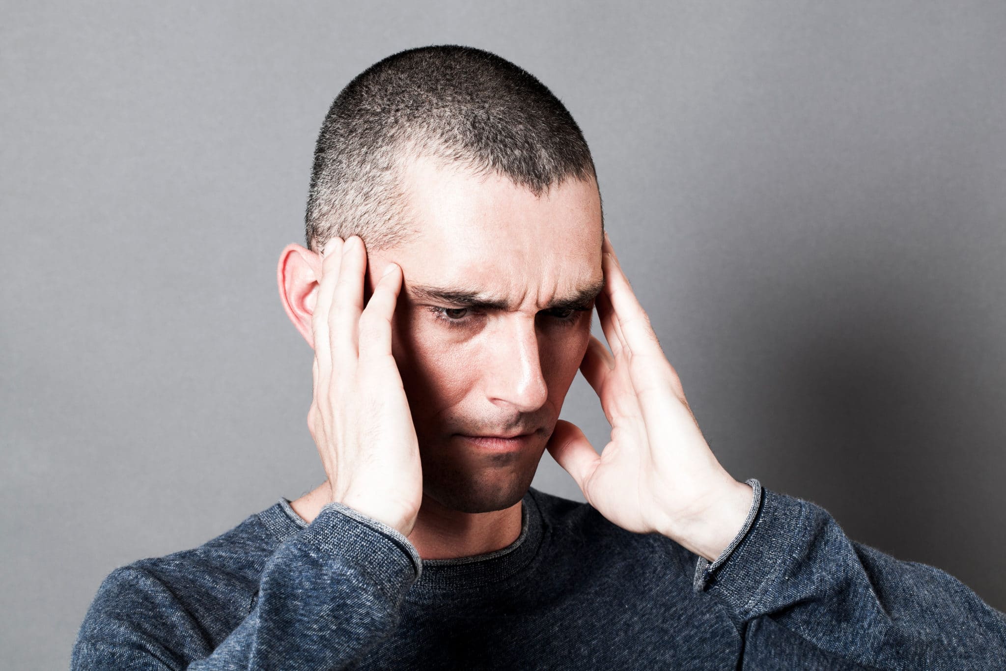 Man holding head in pain