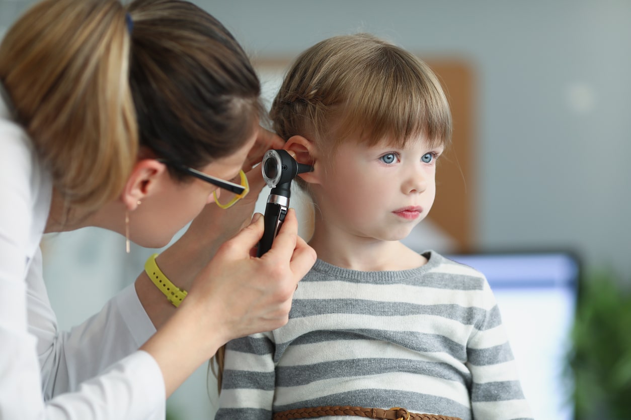 Young girl getting an ear exam